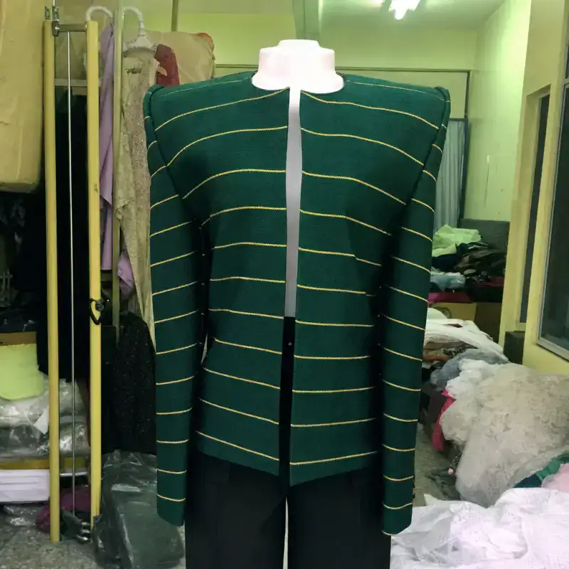 Demo garment, generated: aso-oke jacket on a shop mannequin